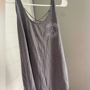 “Don’t worry be hippie” tank with criss cross detail on back
